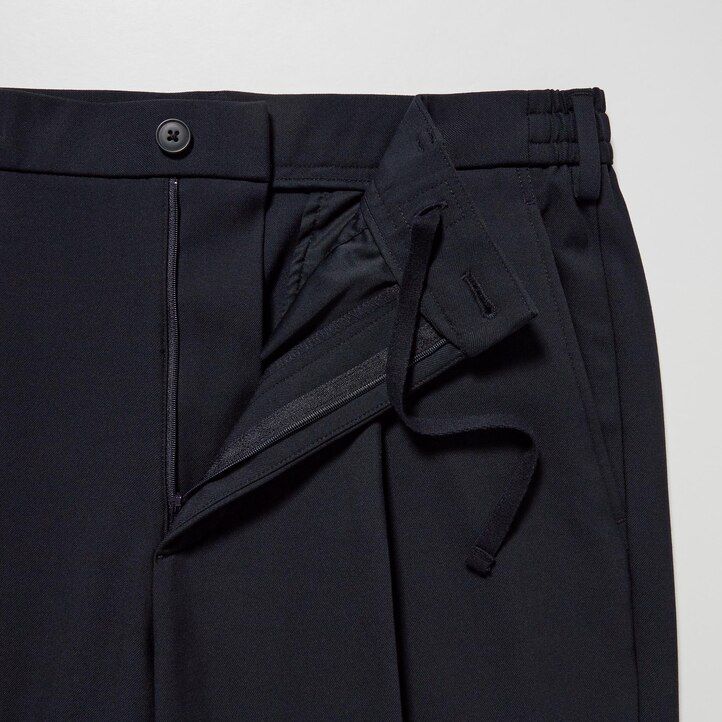 pantaloni uniqlo elasticizzati bidirezionali da uomo con vestibilità affusolata beige