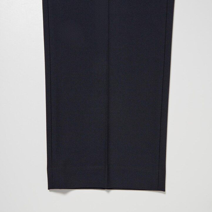 pantaloni uniqlo elasticizzati bidirezionali da uomo con vestibilità affusolata beige